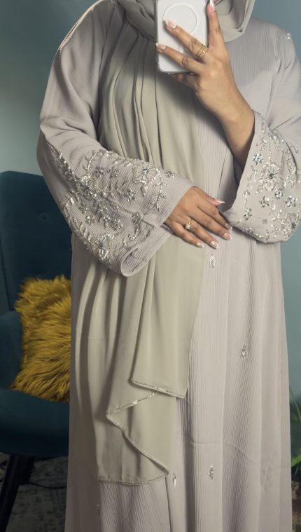 Taupe Korean crepe closed abaya with elegant minimalist design, modest luxury abaya for women, lightweight flowy fabric, formal modest wear suitable for Eid, events, and everyday elegance.