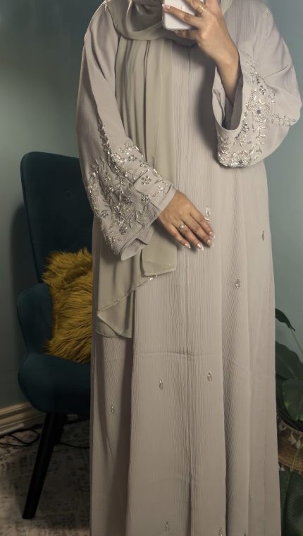 Taupe Korean crepe closed abaya with elegant minimalist design, modest luxury abaya for women, lightweight flowy fabric, formal modest wear suitable for Eid, events, and everyday elegance.